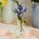 Hand-felted iris flower with firefly in recycled glass mini vase – whimsical spring decor