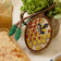 Hand-embroidered beehive ornament with beaded honeybee and shimmering honeycomb