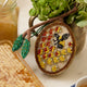 Hand-embroidered beehive ornament with beaded honeybee and shimmering honeycomb