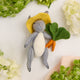 Hand-felted bunny ornament with garden vegetables – wool spring decor from the Gardening Collection.