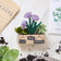 Handcrafted felt herb garden ornament with basil, chives, and rosemary in a cozy felt pot
