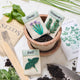 Handmade herb seed packet ornaments in felt—basil, chives, and rosemary with growing instructions