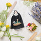 Handcrafted raffia flower basket ornament with vibrant felt blooms and beaded lavender stems.  Ornament of a nun with a basket of lavender too