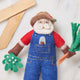 Whimsical gardening Santa with carrot and mistletoe, handmade from felted wool
