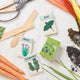Set of three felt herb ornaments styled like seed packets—eco-friendly and handcrafted