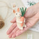 Handcrafted felt bunny ornament holding a carrot—perfect for woodland or Easter-themed decor