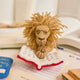 Handmade felt ornament of a wise lion wearing tiny felt glasses, absorbed in a large red book. Crafted from natural wool, this charming lion adds a storybook touch to holiday trees, reading nooks, or cozy corners. A delightful gift for readers, teachers, librarians, or anyone who loves books and imagination. Each ornament is unique, crafted with care using traditional felting techniques.