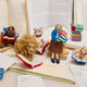 Handmade felt ornament featuring a cozy scene with a bear reading a book, with friends and surrounded by other reading collection favorites.  A heartwarming gift for book-loving families, young readers, and those who cherish the joy of storytelling. Ready to hang with a string attached, it adds a whimsical touch to holiday trees and reading spaces