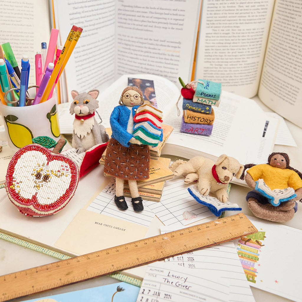 Reading collection featuring a Felt librarian figure ornament, lovingly handmade for bookworms, writers, and those who find joy in every chapter.