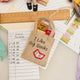 Handmade felt ornament shaped like a tote bag filled with miniature felt books, including titles like Pride & Prejudice and War & Peace. Crafted from soft merino-blended wool, this quirky ornament is a playful nod to literary humor. Perfect for bookworms, teachers, librarians, and pun enthusiasts, it adds a clever touch to holiday trees, bookshelves, or classrooms. Ready to hang with a string attached.
