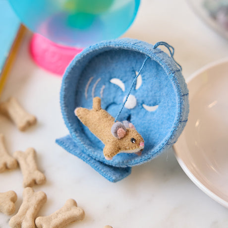 Craftspring’s handmade felt Hamster on a Wheel Christmas ornament with cute embroidered details—displayed among pet supplies to highlight its playful charm, perfect for thoughtful holiday gifting, ethically crafted by artisans using sustainable wool.