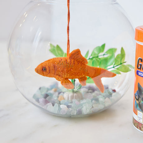 Handmade felt Goldfish ornament from Craftspring, featuring intricate beaded and embroidered shimmering details—displayed in a fish bowl, perfect for aquarium lovers and pet-themed holiday gifting, ethically crafted by artisans using sustainable wool.