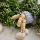Handmade felt Hermit Crab Christmas ornament from Craftspring, with intricate beaded and embroidered details—displayed among evergreens and shells, perfect for ocean lovers and whimsical holiday gifting, sustainably handmade by artisans.