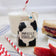 Lifestyle photo of Craftspring’s handmade felt School Milk Carton ornament, featuring embroidered and appliqué details—displayed with a PB&J sandwich, apple slices, and a glass of milk, perfect for nostalgic holiday gifting and lovingly crafted by artisans using sustainable wool.