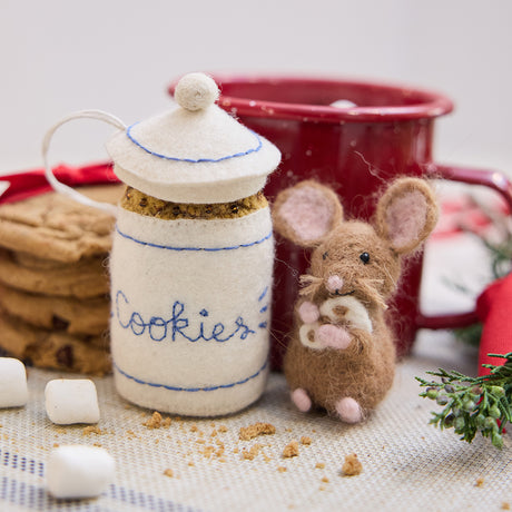 Handmade felt Cookie Jar and Mouse with Cheese ornaments from Craftspring—displayed with hot cocoa and cookies, bringing whimsical charm and cozy Christmas spirit to your holiday decor, ethically crafted by artisans using sustainable wool.