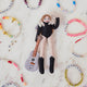 Craftspring’s handmade felt Taylor Swift with Cat Christmas ornament displayed surrounded by friendship bracelets—featuring Taylor holding a guitar with the number 13 and a cat around her shoulders, perfect for Swiftie holiday gifting, ethically crafted by artisans using sustainable wool.