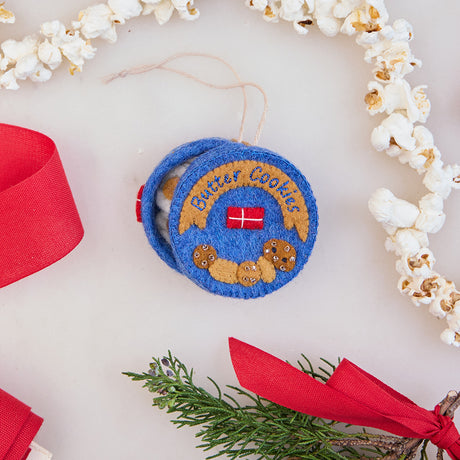 Bring back cherished holiday memories and taste the joy of the season with our felted Butter Cookies Tin Ornament, with beaded and embroidered details galore! shown here with our favorite popcorn garland