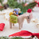 Handmade felt Donkey with Gifts ornament from Craftspring, wearing a Santa hat and carrying toys—displayed among evergreens and a popcorn garland, perfect for Christmas gifting and festive decor, ethically crafted by artisans using sustainable wool.