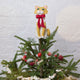 Handmade felt Orange Cat Tree Topper from Craftspring, wearing a festive red bow—perched proudly on a Christmas tree, bringing playful holiday cheer and purr-fect gifting joy, ethically crafted by artisans using sustainable wool.