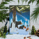 Craftspring’s handmade Woodland Minis Advent Calendar — back side featuring an illustration of woodland animals with a present and a shooting star, displayed with evergreens and snow for a magical Christmas scene, ethically crafted by artisans using sustainable wool.