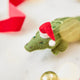 Craftspring’s Santa Alligator Ornament — felt alligator with a beautiful face and embroidered and beaded back ridges — close-up showing face details, highlighting whimsical holiday charm and heirloom-quality Christmas gifting, ethically crafted by artisans using sustainable wool.