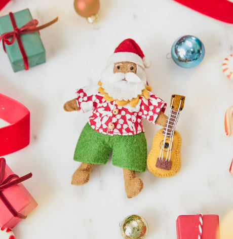 Handmade felt Tropical Santa Ornament from Craftspring, featuring Santa in a Hawaiian Aloha shirt holding a ukulele — festive heirloom-quality Christmas decor, ethically crafted by artisans using sustainable wool.