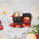 Craftspring’s Steam Engine Train Ornament — felt black and red train with gold embroidery and beading, fluffy steam, and a wreath on the back — displayed on snow with evergreens, capturing whimsical holiday spirit, cozy Christmas warmth, and heirloom-quality gifting, ethically crafted by artisans using sustainable wool.