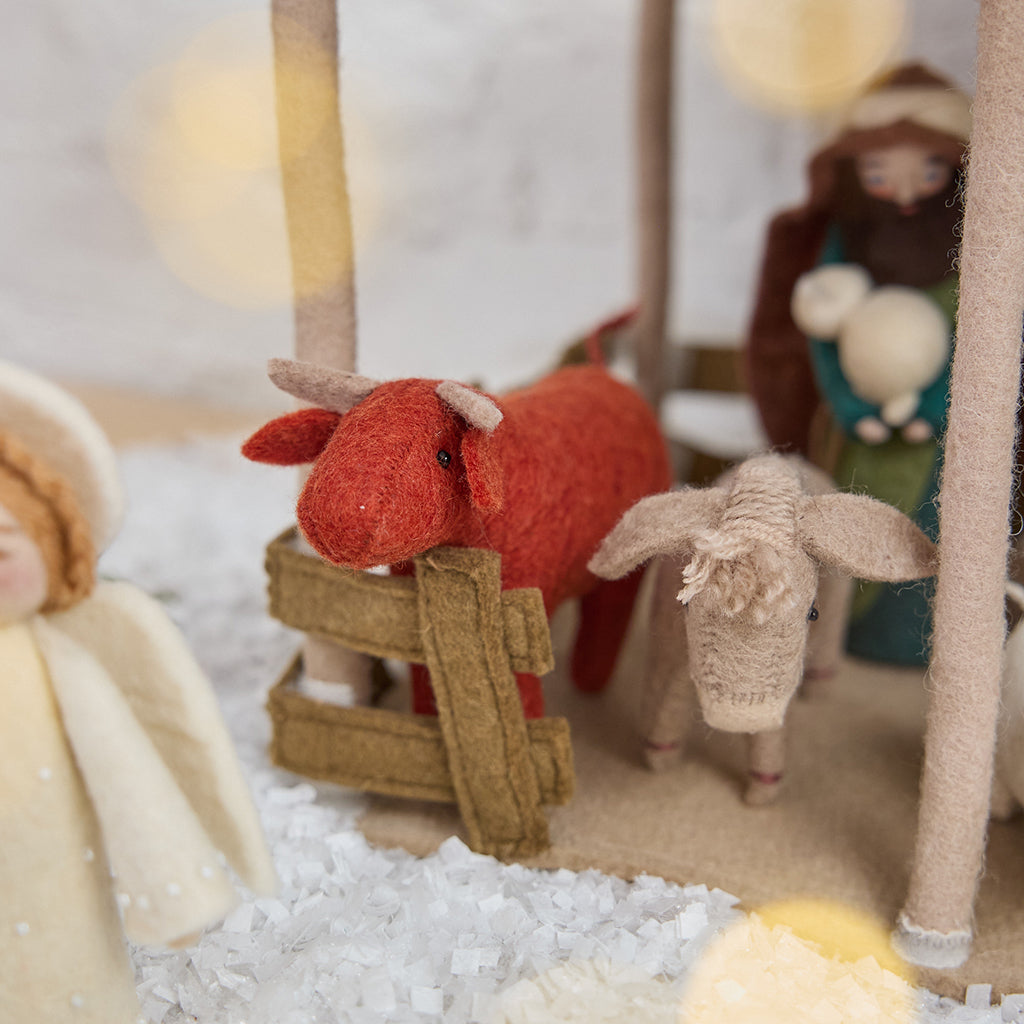 Nativity Barn displaying the shepherd with animals inside — handmade felt with detailed design to hold Craftspring’s Holy Night Nativity Scene, ethically crafted by artisans using sustainable wool.