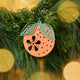 Close-up of Craftspring’s Paper Clementine Garland — showing the intricate handmade paper details of a clementine with leaves, displayed on an evergreen garland for warm Christmas and holiday decor, ethically handmade by artisans from recycled cotton waste.