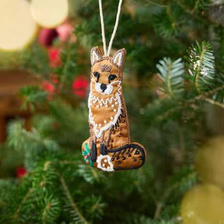 Craftspring’s Fox Beaded ornament — made of satin with intricate beaded and embroidered details, displayed on a Christmas tree for a festive woodland holiday scene, ethically crafted by artisans.