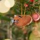 Craftspring’s Sleepy Fox Ornament displayed on a Christmas tree — needle felted with a curled-up body, cute face, fluffy tail, and whiskers, bringing festive warmth and woodland charm to your holiday traditions — heirloom-quality decor, ethically crafted by artisans using sustainable wool.