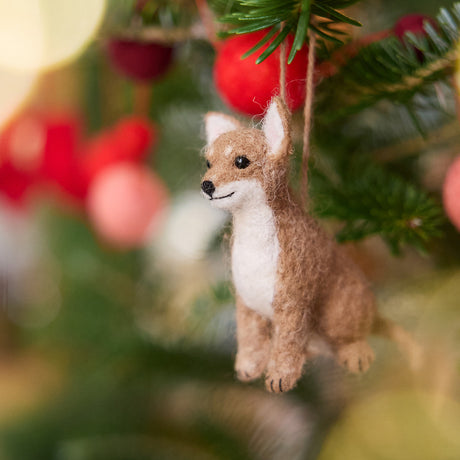 Craftspring’s Chihuahua Ornament displayed on a Christmas tree—needle-felted with big ears and a cute face, adding playful holiday warmth and gifting charm, ethically crafted by artisans using sustainable wool.