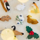 Close-up of Craftspring’s Woodland Minis Advent Calendar ornaments — showing the intricate embroidered and beaded details of the tiny woodland designs, heirloom-quality Christmas treasures ethically crafted by artisans using sustainable wool.