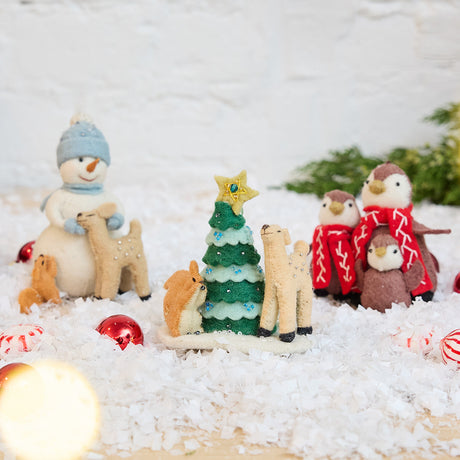 Craftspring’s Tender Woodland Ornaments Bundle — includes Snowman with Friends Ornament, Deer & Squirrel Decorating Tree Ornament, and Penguin Family Ornament — displayed together in a cozy holiday setting, highlighting sweet and tender designs with intricate beaded and embroidered details, evoking festive warmth and heirloom-quality Christmas gifting, ethically crafted by artisans using sustainable wool.