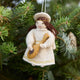 Vintage-Style Angel Playing Lute Ornament from Craftspring displayed on a Christmas tree — handmade felt ornament with intricate beaded and golden embroidered details, depicting an angel playing a lute, ethically crafted by artisans using sustainable wool for festive holiday gifting.