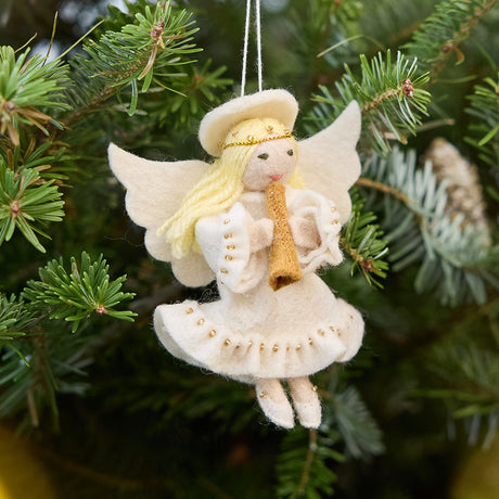 Vintage-Style Angel Playing Trumpet Ornament from Craftspring displayed on a Christmas tree — handmade felt ornament with sweet face and intricate beaded and embroidered details, depicting an angel playing a trumpet, ethically crafted by artisans using sustainable wool for festive holiday gifting.