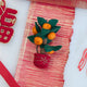Handmade felt Clementine Tree Ornament from Craftspring, featuring a red pot with gold embroidery and a tree with eight bright clementines — heirloom-quality Lunar New Year decor, a joyful symbol of abundance and gifting, ethically crafted by artisans using sustainable wool.