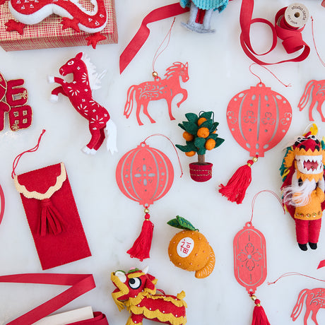 Craftspring’s Chinese Red Horse Ornament displayed alongside other paper and felt Lunar New Year ornaments, creating a joyful, heirloom-quality holiday display rich with festive detail.