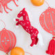 Chinese Red Horse Ornament displayed with paper lanterns, highlighting its beaded and embroidered Lunar New Year details for festive gifting and decor.