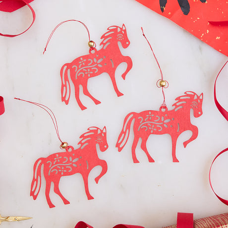 Craftspring’s Paper Horse Ornaments - Set of 3, displayed with bright red ribbon, highlighting their festive paper craftsmanship. Ethically handmade by artisans for meaningful Lunar New Year celebrations.