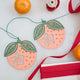 Paper Clementine Garland — set of 2 handmade garlands, each with 5 clementines featuring leaves and intricate cutout details, ethically handmade by artisans from recycled cotton waste — festive Christmas, holiday, and Lunar New Year decor, perfect for joyful gifting.