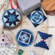 Handmade Indigo Quilted Ornaments, Set of 4, from Craftspring—displayed with quilting supplies, showcasing heirloom-quality Christmas decor, holiday crafting inspiration, and gifting, ethically handmade by artisans.