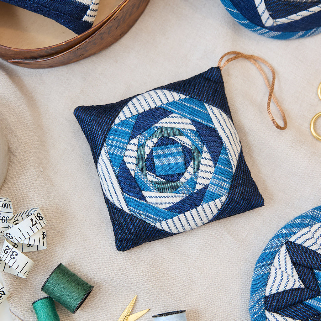 Indigo Quilted Ornament from Craftspring’s Set of 4 displayed among craft supplies—highlighting heirloom-quality quilting, festive holiday crafting, and thoughtful Christmas gifting, ethically handmade by artisans.