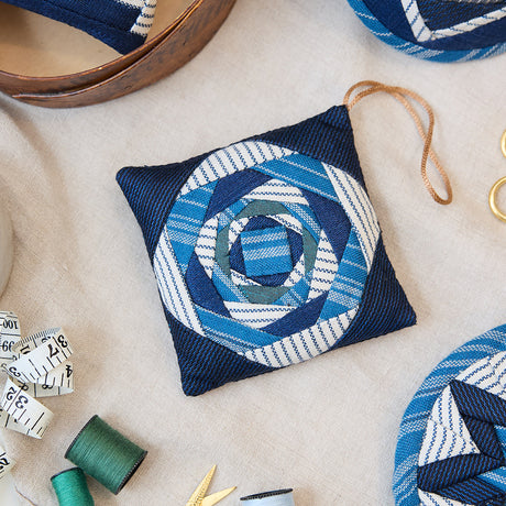 Indigo Quilted Ornament from Craftspring’s Set of 4 displayed among craft supplies—highlighting heirloom-quality quilting, festive holiday crafting, and thoughtful Christmas gifting, ethically handmade by artisans.