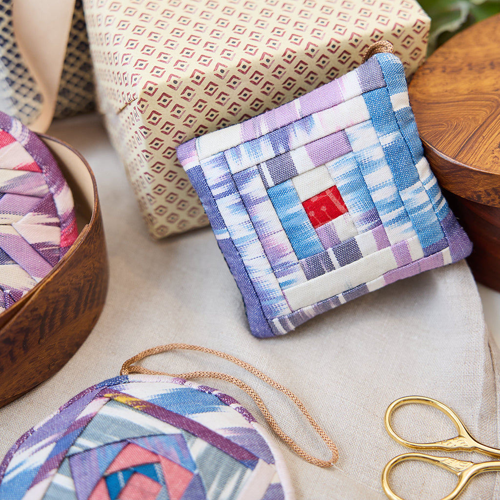 Ikat Quilted Ornament from Craftspring’s Set of 4 displayed among craft supplies—highlighting heirloom-quality quilting, festive holiday crafting, and thoughtful Christmas gifting, ethically handmade by artisans.