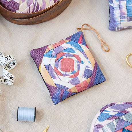 Ikat Quilted Ornament from Craftspring’s Set of 4 displayed among craft supplies—highlighting heirloom-quality quilting, festive holiday crafting, and thoughtful Christmas gifting, ethically handmade by artisans.