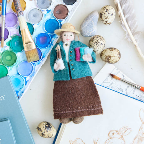 Felted Figure of Beatrix Potter holding her sketch books, and paintbrushes. Cute as can be gift and ornament from Craftspring