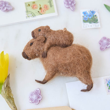 A needle-felted alpaca wool capybara and baby ornament from Peru, symbolizing calm, nurturing love, and gentle family bonds—perfect for meaningful gifting and cozy decor.
