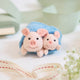 Cozy, cuddly, and completely irresistible—our Pigs in a Blanket Ornament is here to wrap your holidays in pure joy. Featuring a sweet pig parent and baby snuggled snugly inside a soft blue “blanket,” this playful design brings together comfort, humor, and heartfelt connection in the most delightful way.