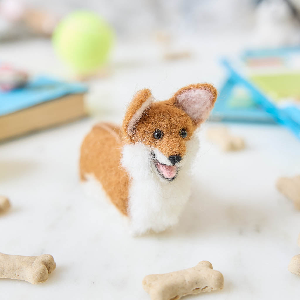 Bring a little wagging joy to your holiday decor with our irresistibly cute Felted Alpaca Corgi Ornament. Lovingly handmade by skilled artisans, this cheerful pup features the corgi’s signature golden coat, perky ears, and—of course—its famously adorable heart-shaped butt.